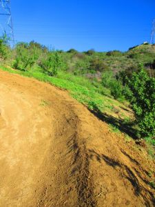 It's a bit disheartening to see all the trail "enhancing" going on at Santiago Oaks . . . berming the curves like this does not seem like the work of equestrians or hikers, who fear the high speeds this kind of trail encourages in the wheeled community . . . 